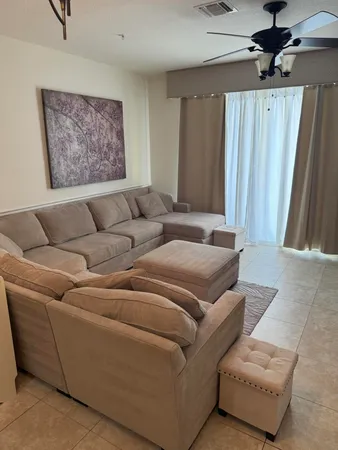 a living room with furniture and a rug