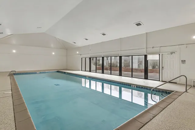 a room with gym equipment and white walls