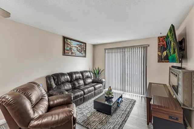 a view of a lake with houses in the background