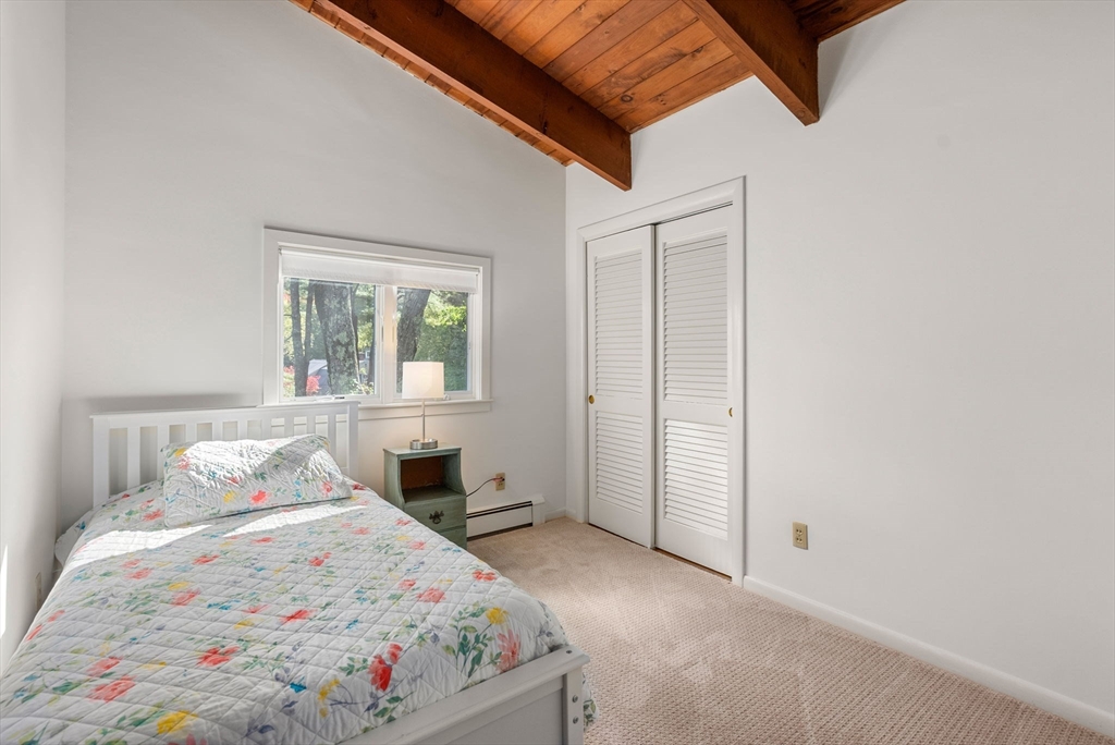 148 Oxbow Road Wayland, MA 01778 - Photo 21 of 32 a bedroom with a bed and a window