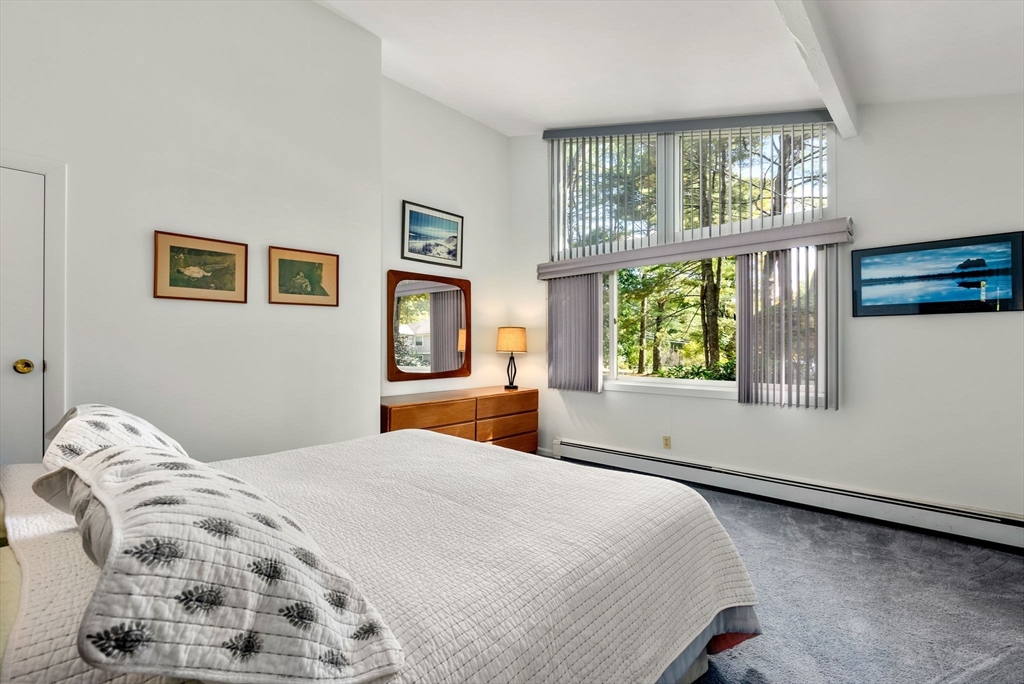 148 Oxbow Road Wayland, MA 01778 - Photo 23 of 32 a bedroom with a large bed and a window