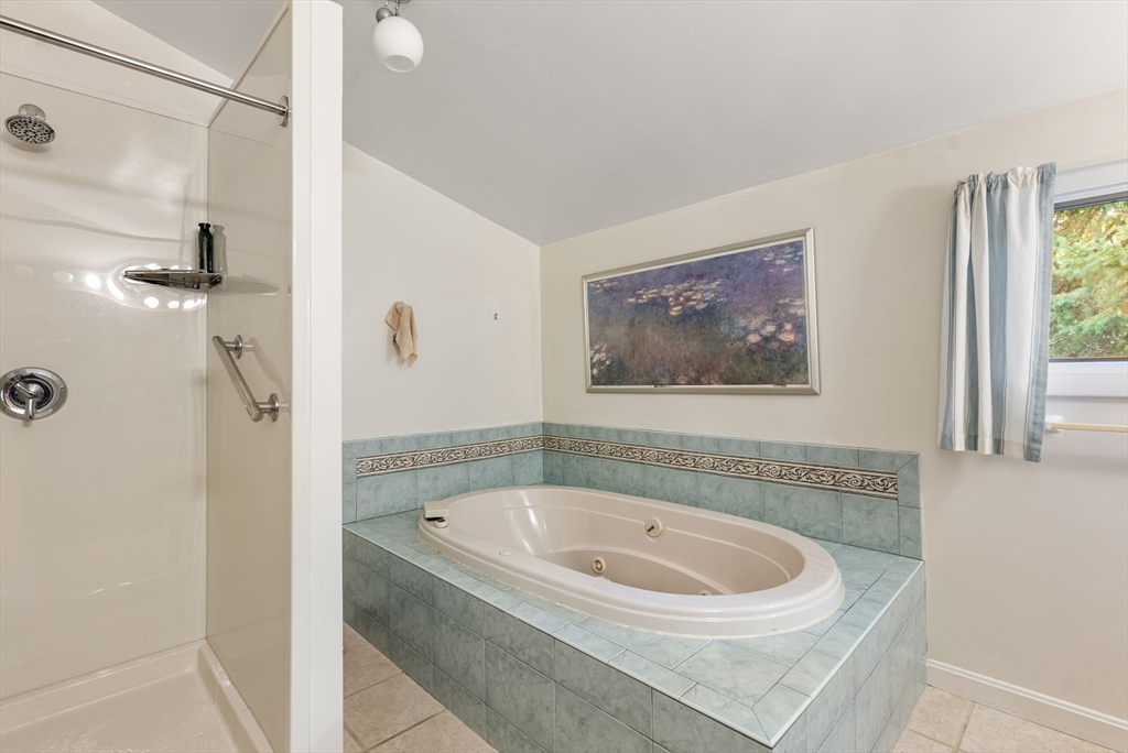 148 Oxbow Road Wayland, MA 01778 - Photo 25 of 32 a bathroom with a bathtub and a shower