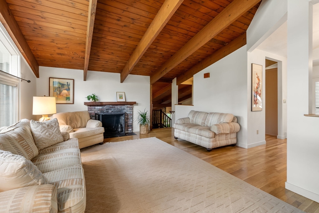 148 Oxbow Road Wayland, MA 01778 - Photo 4 of 32 a living room with furniture and a fireplace