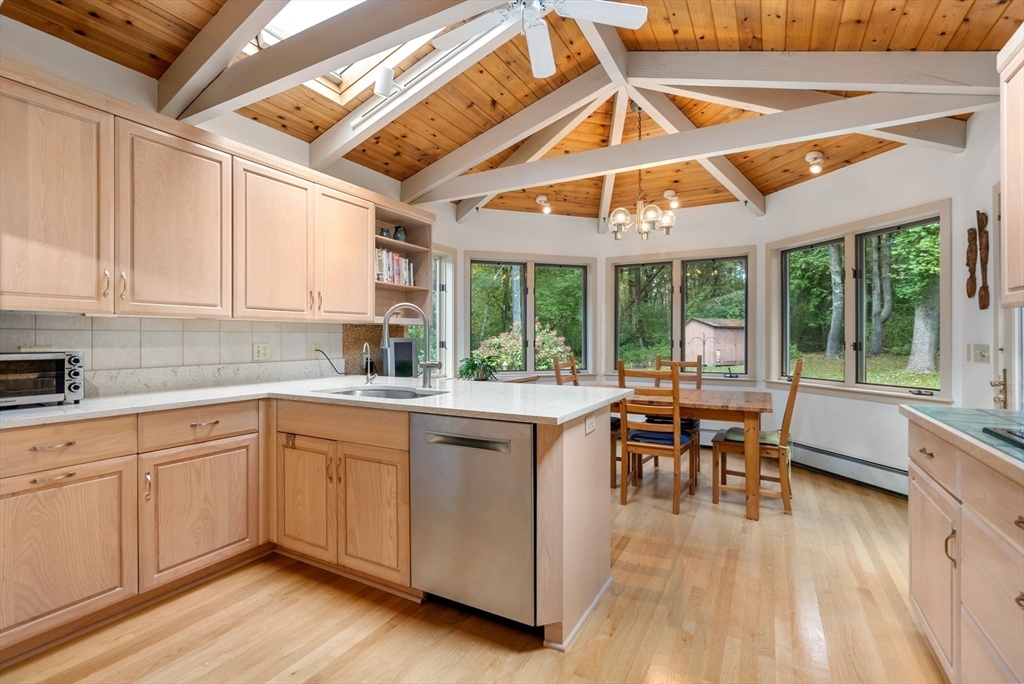 148 Oxbow Road Wayland, MA 01778 - Photo 8 of 32 a kitchen with a sink and wooden cabinets