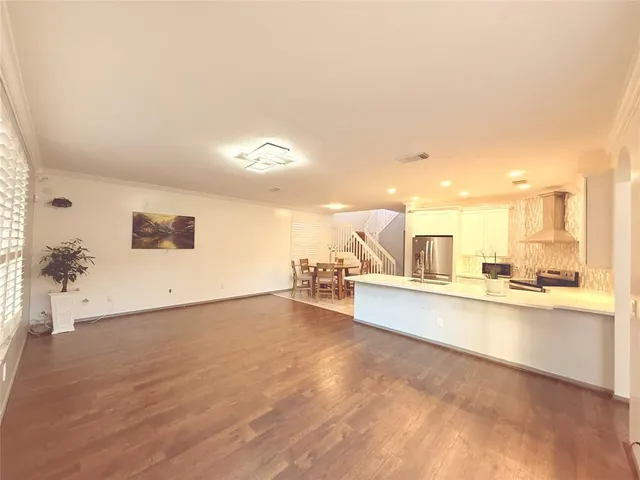 a view of a living room and kitchen
