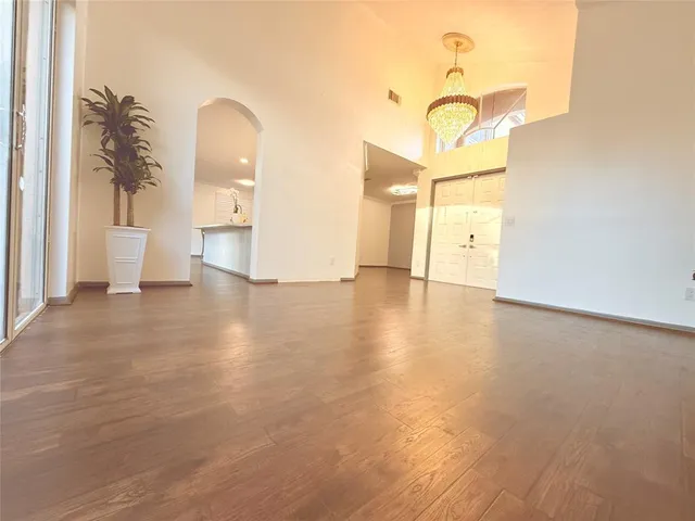 a view of a living room with a wooden floor