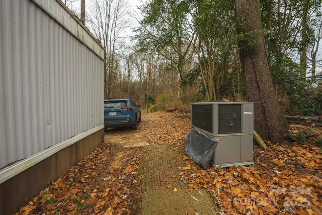 a backyard of a house with table and chairs