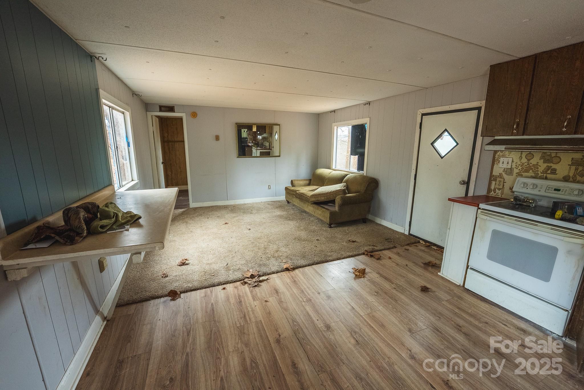 9336 Pinewood Avenue Charlotte, NC 28214 - Photo 20 of 37 a living room with furniture and a flat screen tv