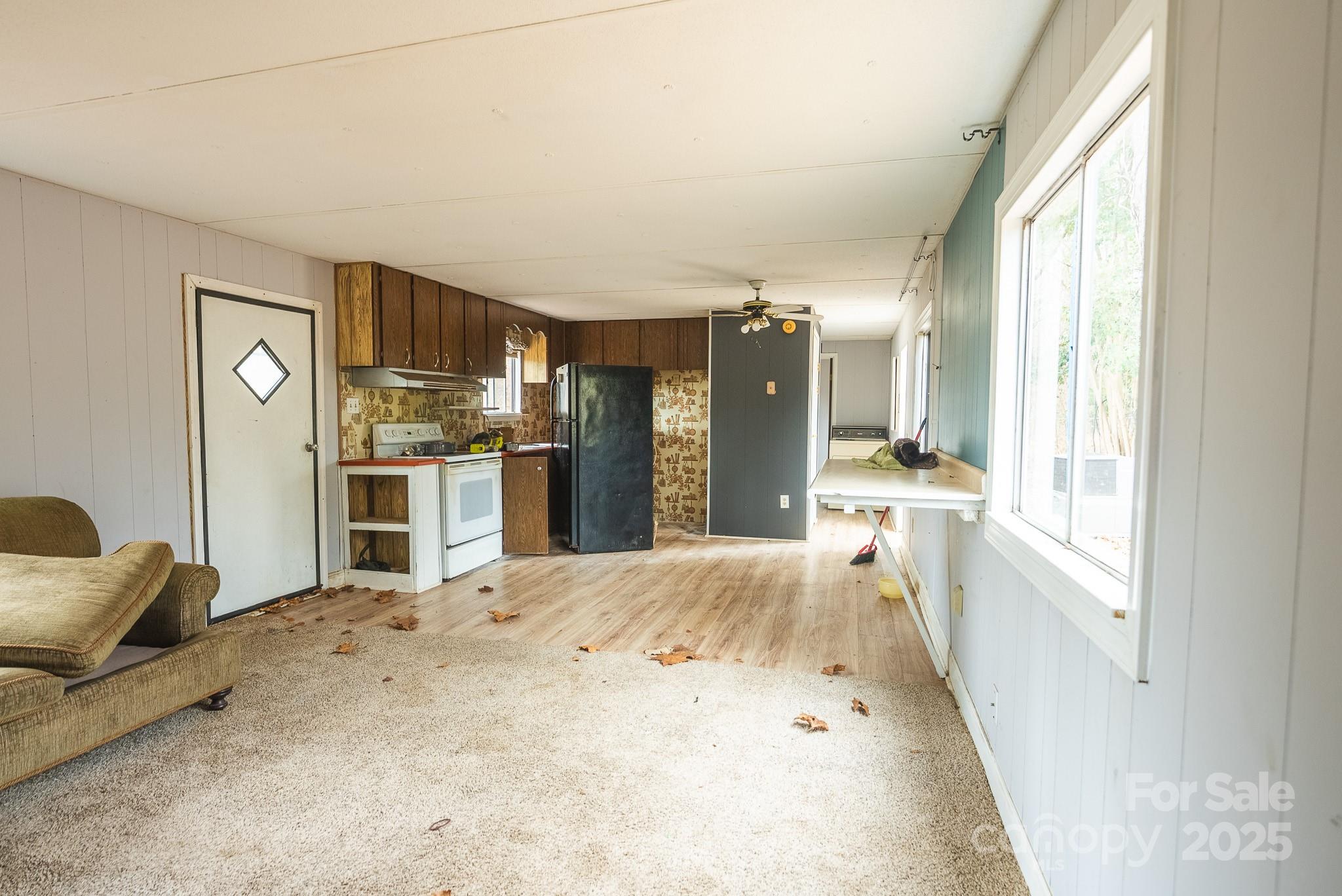 9336 Pinewood Avenue Charlotte, NC 28214 - Photo 22 of 37 a large kitchen with kitchen island a sink stove and refrigerator