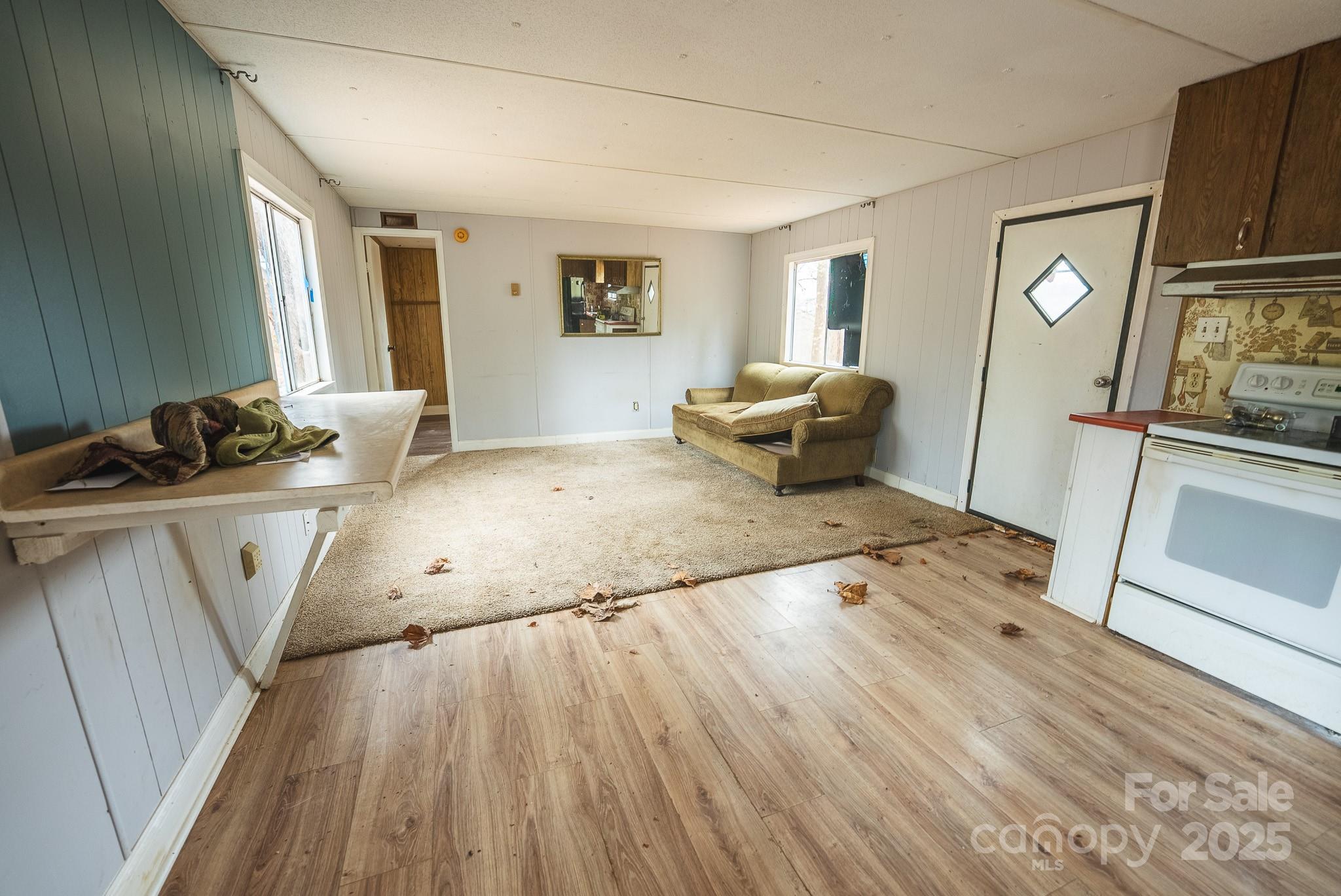 9336 Pinewood Avenue Charlotte, NC 28214 - Photo 23 of 37 a bedroom with a bed and wooden floor