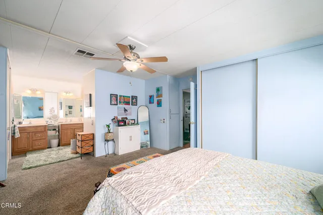 a bed room with a bed and a chandelier