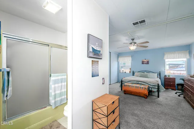 a bedroom with bed and window