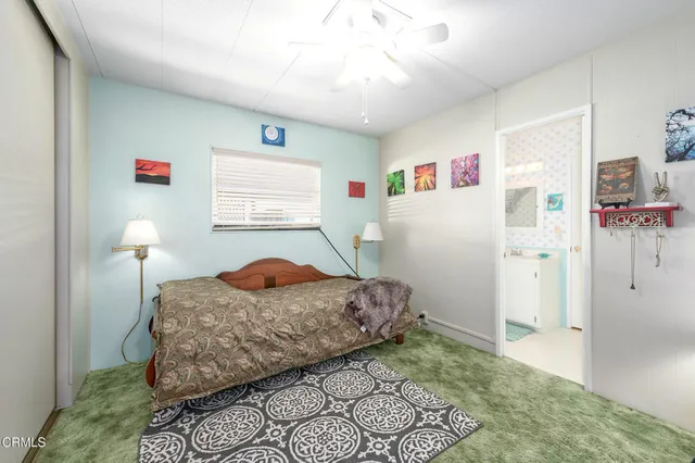 a bedroom with a bed and a cabinets