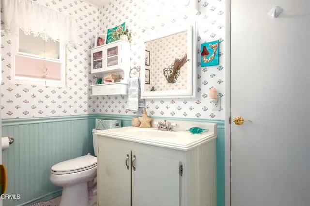 a bathroom with a sink and a toilet