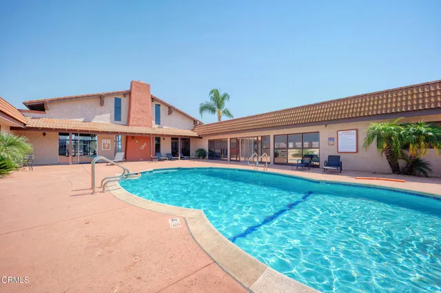 a view of a hall with sitting area