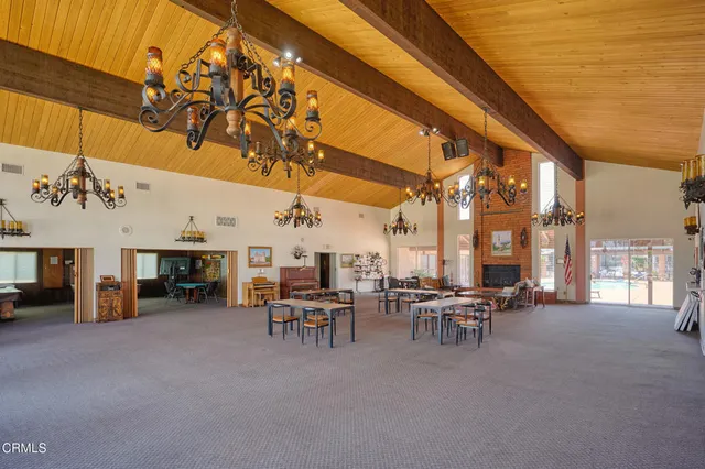a view of a a dining room with furniture window and wooden floor