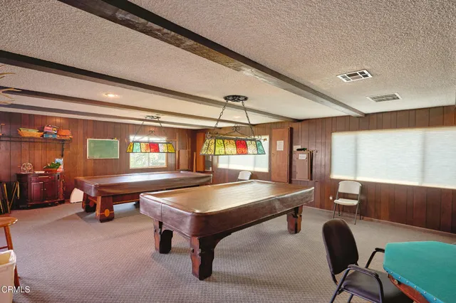 a view of a house with large tree