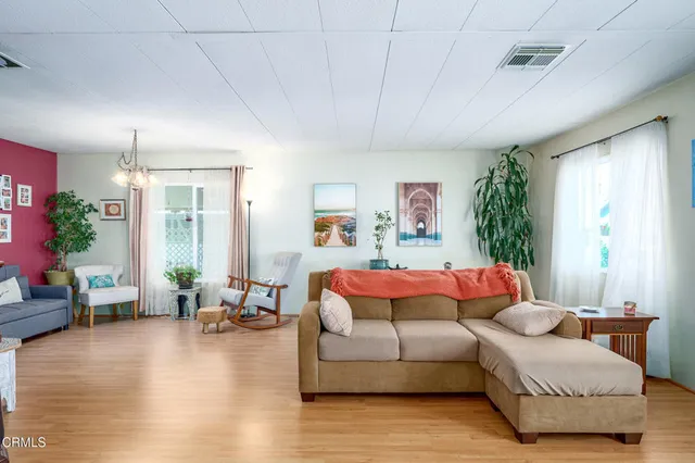 a room with furniture and wooden floor