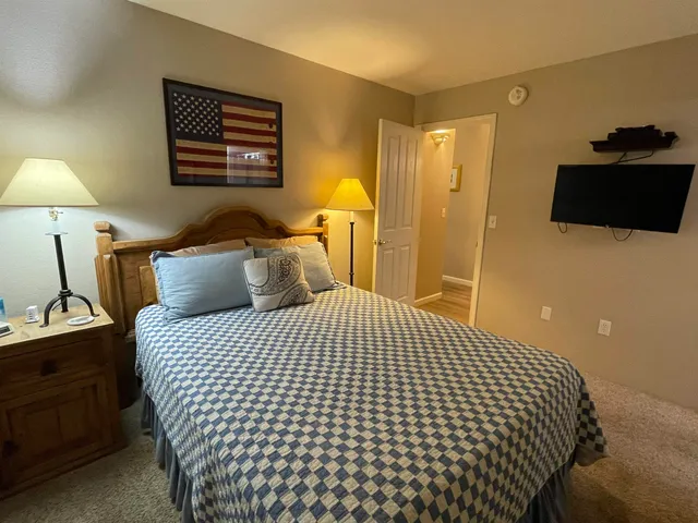a bathroom with a shower sink and mirror