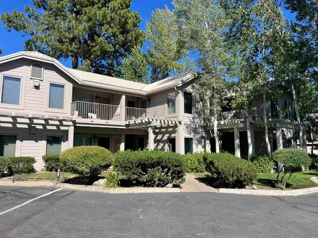 a bed room with a bed and a chair