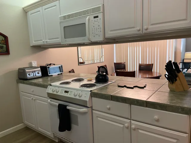 a kitchen with appliances cabinets and a counter top
