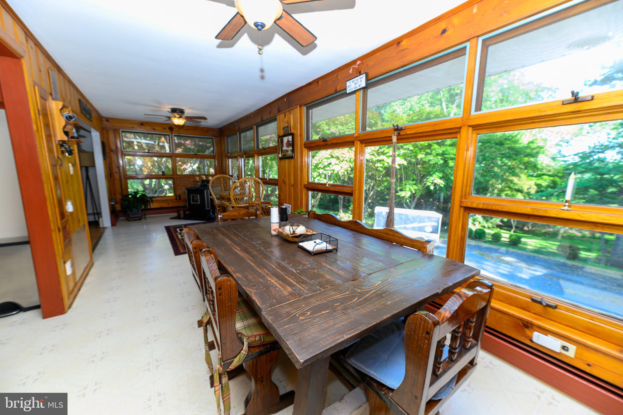 4619 Long Green Road Glen Arm, MD 21057 - Photo 29 of 74 Sunlit dining space with nature views.