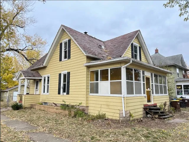 a front view of a house with many windows