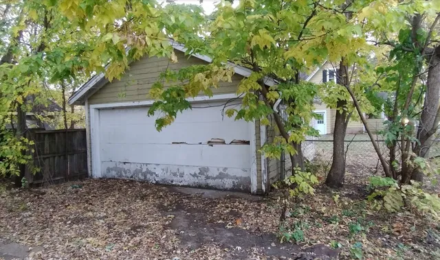 a view of a house with a tree