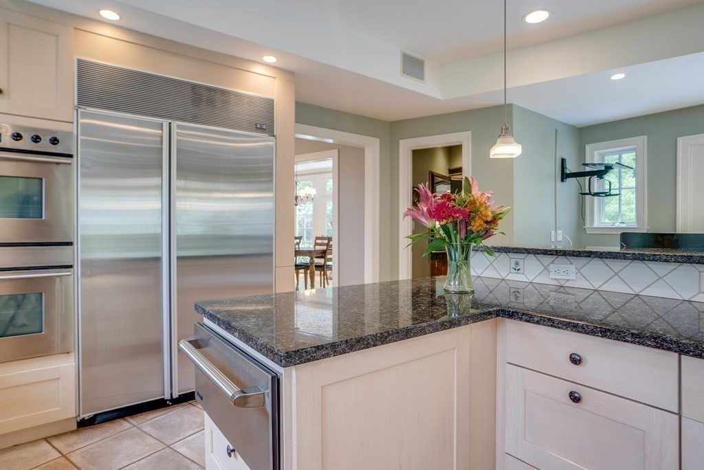 204 Pope Road Acton, MA 01720 - Photo 13 of 40 a kitchen with stainless steel appliances granite countertop a refrigerator a sink and a counter top space