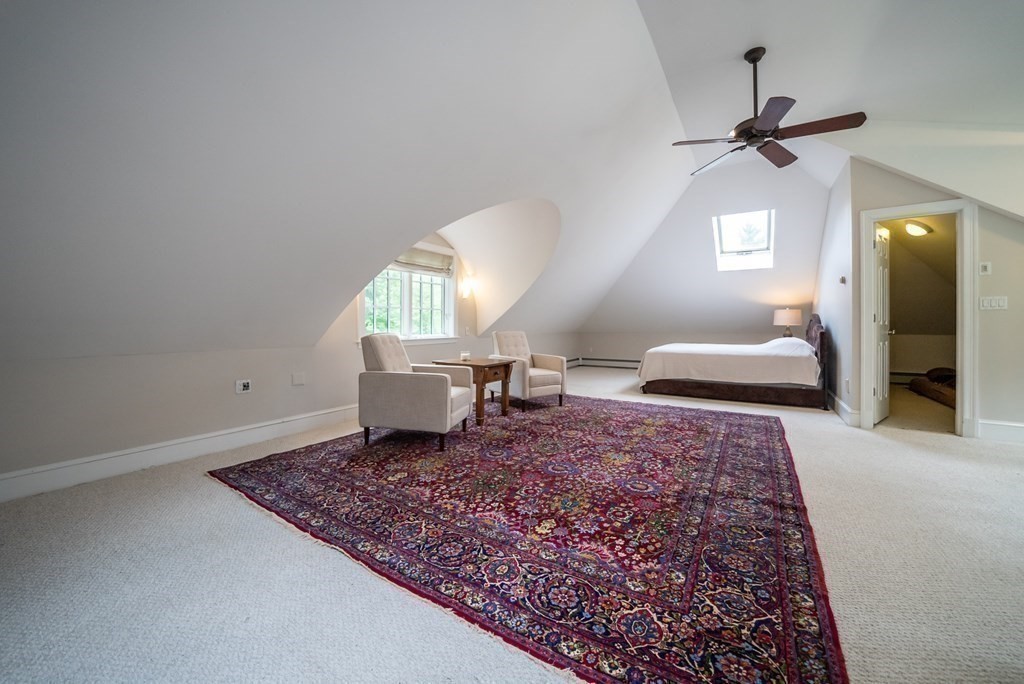 204 Pope Road Acton, MA 01720 - Photo 32 of 40 a living room with a couch and a rug
