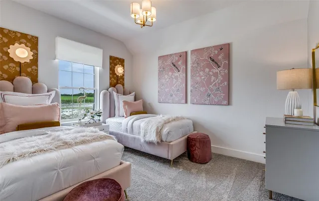 a bedroom with bed and a chandelier