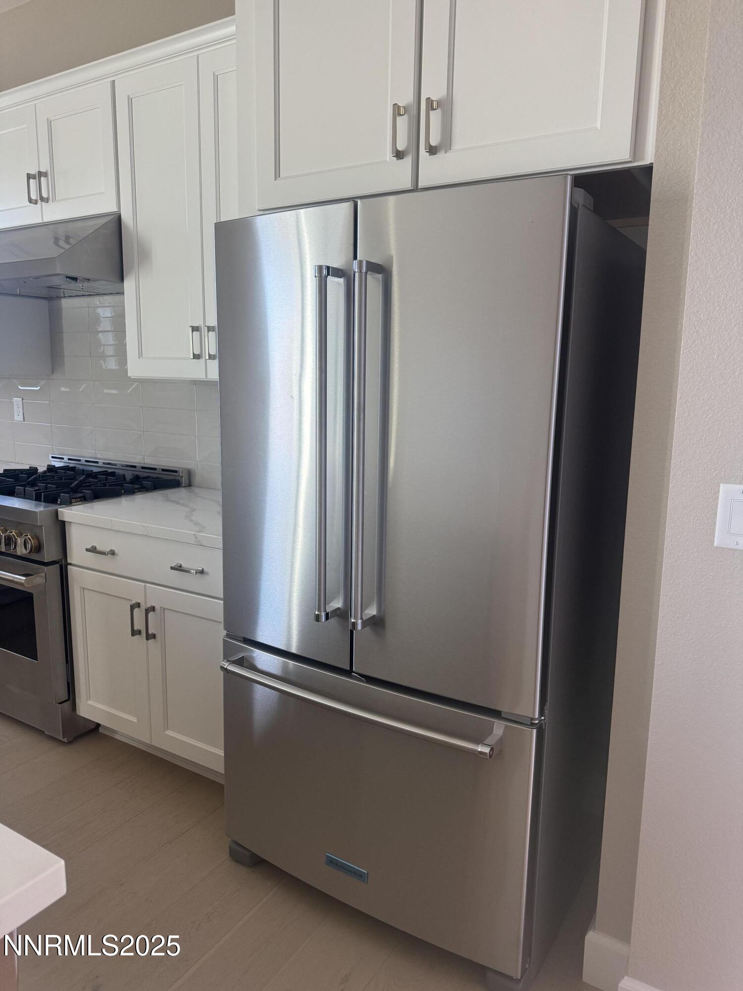 1513 Golf Club Drive Reno, NV 89519 - Photo 2 of 34 a white refrigerator freezer and a stove sitting inside of a kitchen
