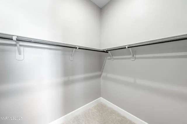 a bathroom with double sink and a mirror