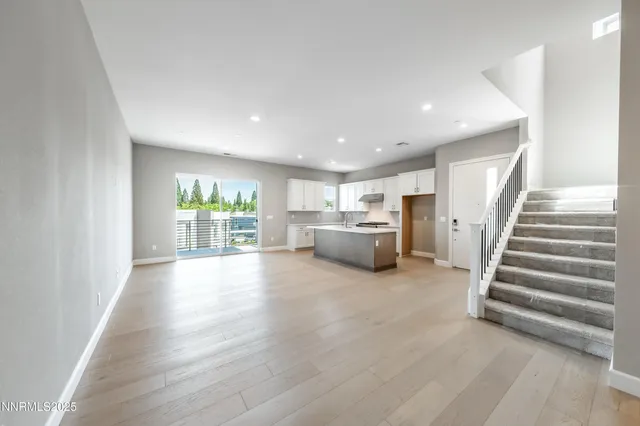 a kitchen with a sink and large window