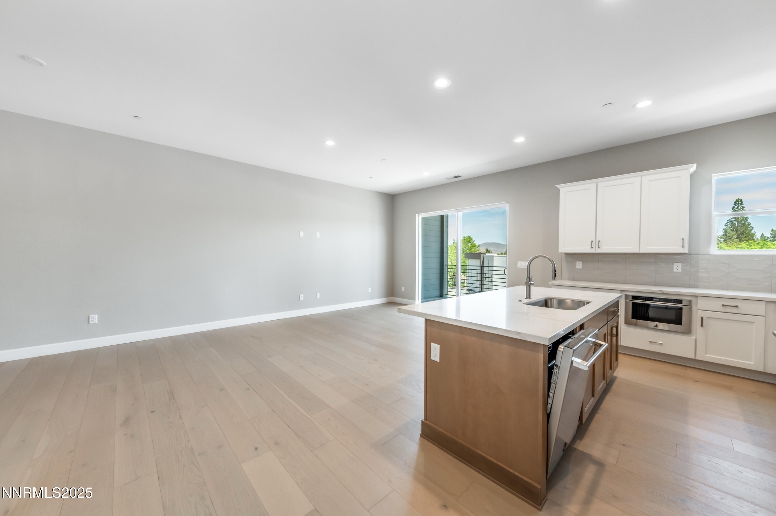 1513 Golf Club Drive Reno, NV 89519 - Photo 6 of 34 a kitchen with a stove and a sink