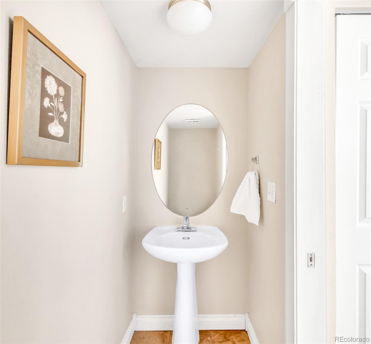 1650 South Deframe Street, Unit B5 Lakewood, CO 80228 - Photo 12 of 40 a bathroom with a sink and a mirror