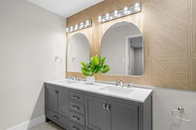 a kitchen with stainless steel appliances a sink stove and cabinets