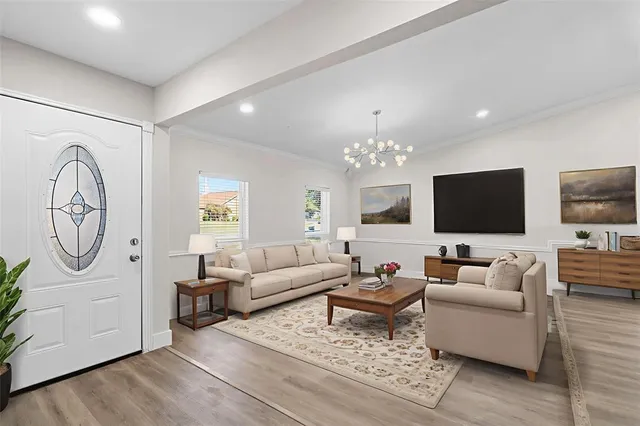a view of a dining room with furniture and wooden floor
