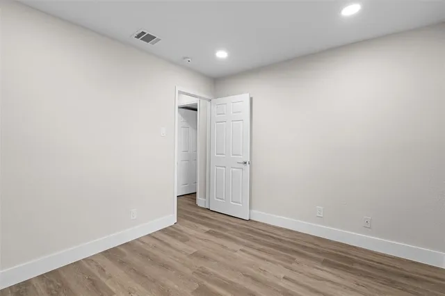 a view of a workspace with furniture and bookshelf