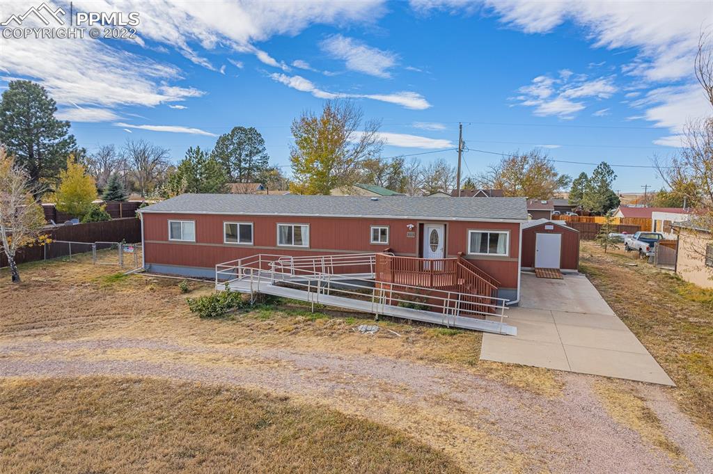 315 Cheyenne Street Calhan, CO 80808 - Photo 1 of 28 a view of a house with a yard
