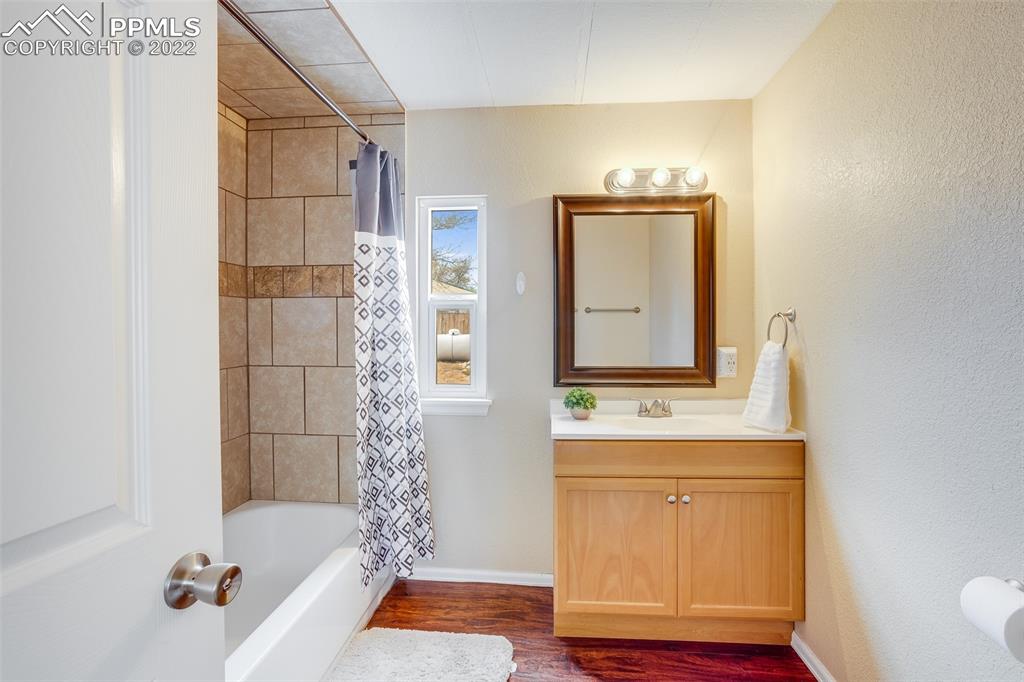 315 Cheyenne Street Calhan, CO 80808 - Photo 12 of 28 a bathroom with a sink a toilet and shower