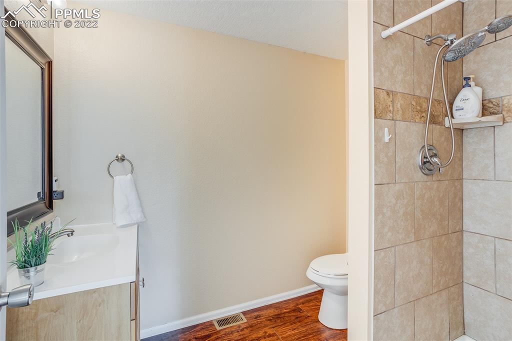 315 Cheyenne Street Calhan, CO 80808 - Photo 17 of 28 a bathroom with a toilet and a shower