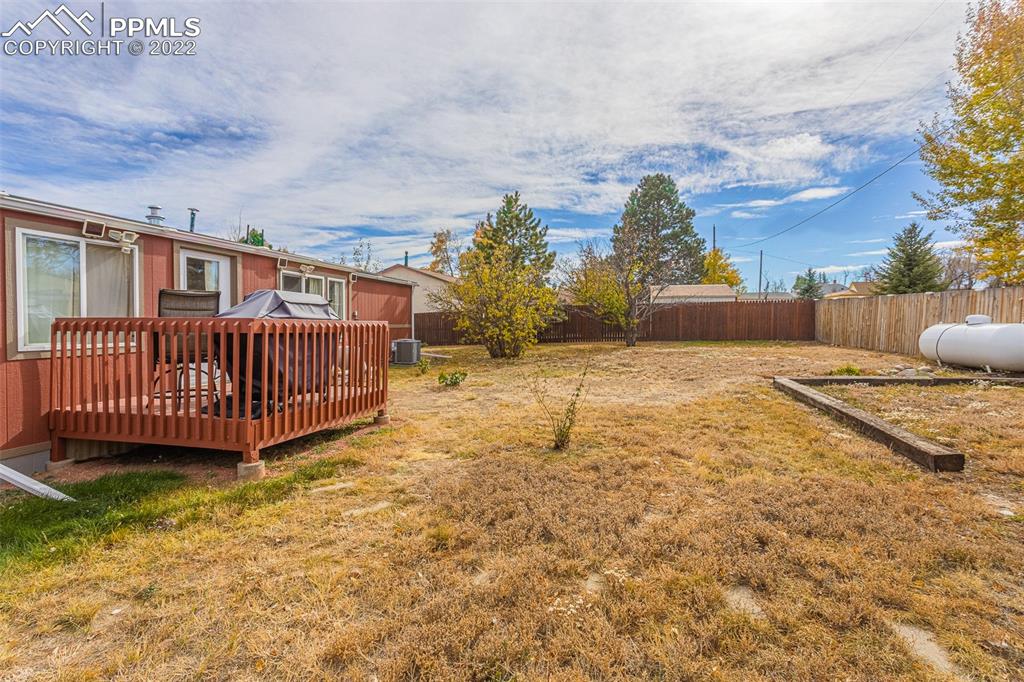 315 Cheyenne Street Calhan, CO 80808 - Photo 19 of 28 a view of a backyard with a small cabin