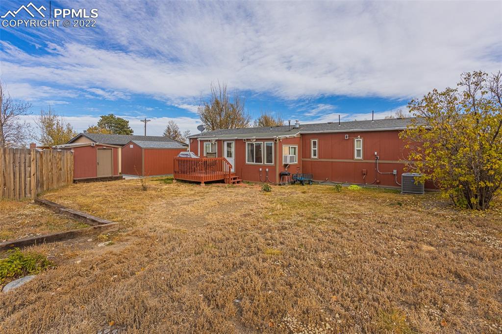 315 Cheyenne Street Calhan, CO 80808 - Photo 20 of 28 a view of a house with a yard