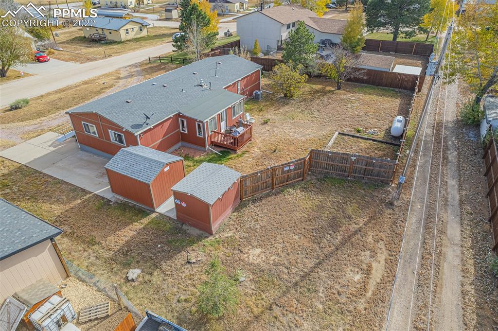 315 Cheyenne Street Calhan, CO 80808 - Photo 25 of 28 an aerial view of a house with a yard
