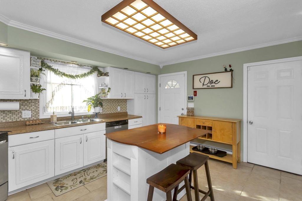 21 Brentwood Street Springfield, MA 01108 - Photo 12 of 41 a kitchen with stainless steel appliances granite countertop a stove a sink dishwasher and a refrigerator