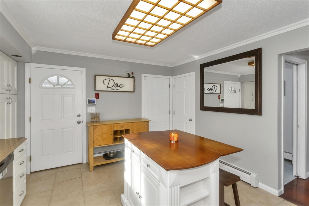 21 Brentwood Street Springfield, MA 01108 - Photo 16 of 41 a room with table and chair