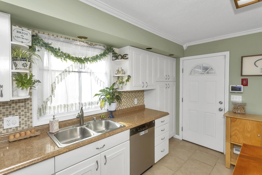 21 Brentwood Street Springfield, MA 01108 - Photo 17 of 41 a kitchen with a sink and refrigerator