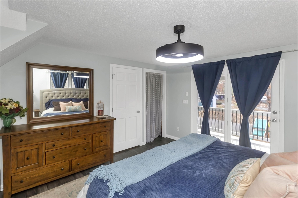 21 Brentwood Street Springfield, MA 01108 - Photo 22 of 41 a bedroom with a bed and a chandelier