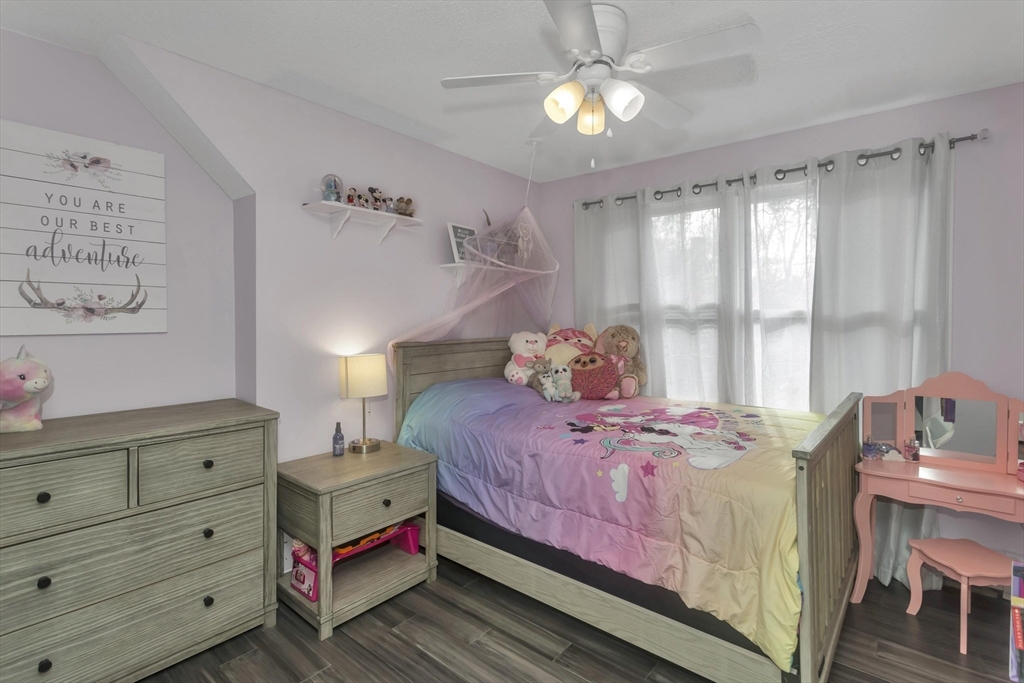 21 Brentwood Street Springfield, MA 01108 - Photo 23 of 41 a bedroom with a bed and a table in it